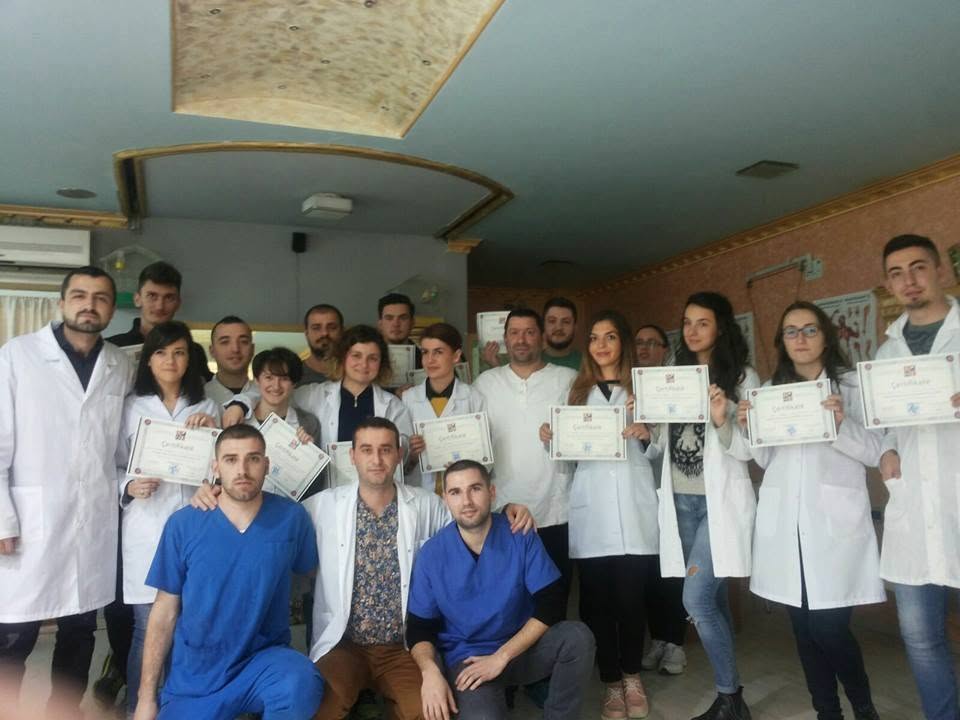 Group of SHRFPAK rehabilitation participants and professionals holding training certificates