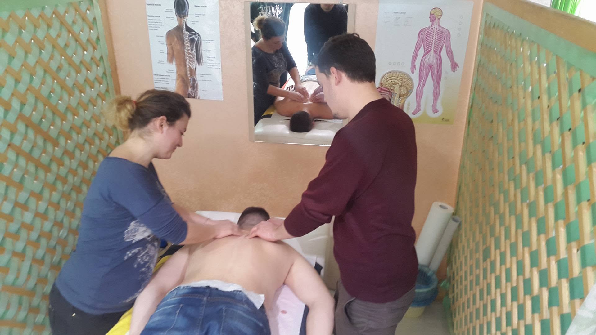 Two rehabilitation practitioners providing hands-on therapy during an SHRFPAK session